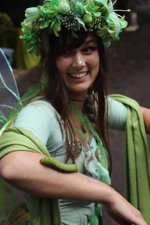 aspenwitch: Maybe my favorite ever photo from a faire day, candid with a great big luna moth caterpi
