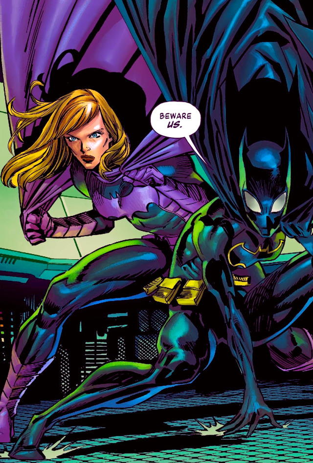 Batgirls Stephanie Brown and Cassandra Cain crouch, Stephanie behind Cassandra, in fighting stances. They're in front of many green computer screens. Cassandra's speech bubble reads, "Beware us."
