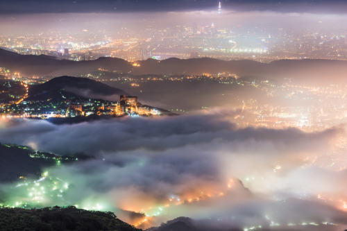 astoryforsupper:  nubbsgalore:  taipei glows under a blanket fog in these photos by wang wei zheng. (see also: dubai)  i want to print all of these on a ginormous blanket and wrap it around myself at all times because they’re so beautiful 