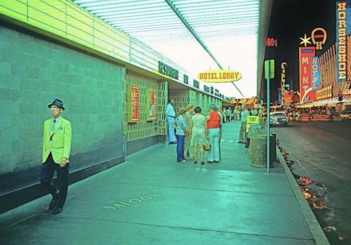 vintagelasvegas:Fremont Street from under the marquee of Four Queens, c. 1975. Photos by Mitchell Fu