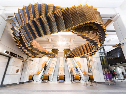 itscolossal: 80-Year-Old Wooden Escalators are Repurposed as a Sculptural Ribbon by Artist Chris Fox