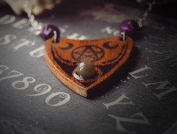 forgetallyouarein80s:  New ouija inspired pendants will be on sale very soon! I need your opinion: does it make sense to make more such planchette pendants with crystals, bones etc ?