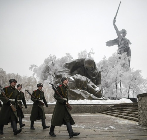 fnhfal:  Members of the Honour Guard walk near the Motherland Calls statue in Volgograd.