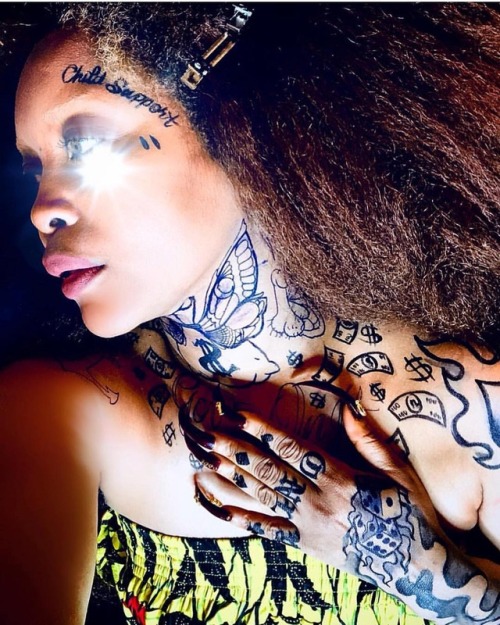 @erykahbadu I WISH! She was tatted like this. Either way she looks great