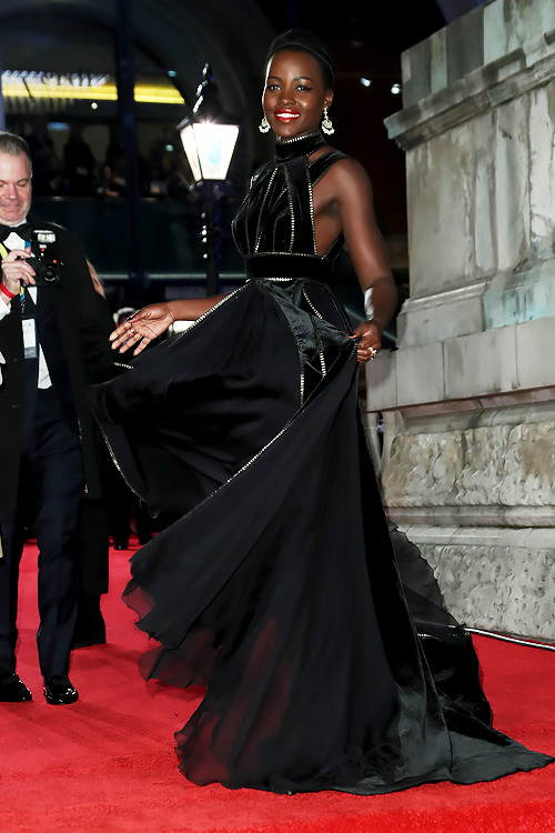 newtscamand-r:Lupita Nyong’o (in Elie Saab) attends the 71st British Academy Film Awards at Royal Al