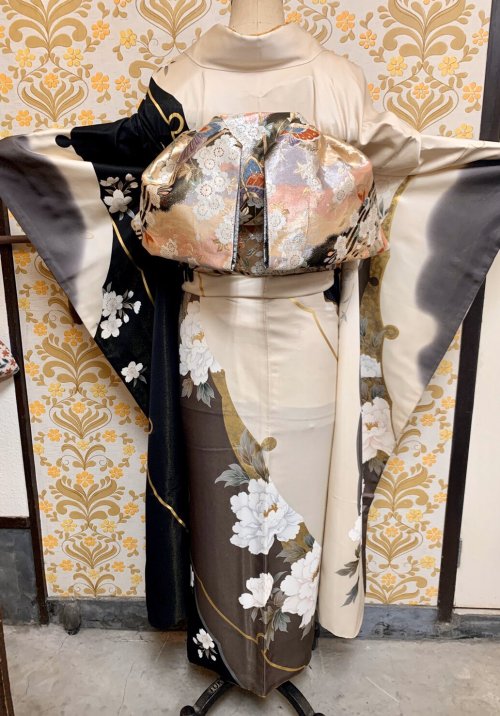 Regal furisode (seen on) depicting dramatic botan (peonies) and scattered sakura (cherry blossoms) o