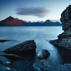 juliancalverley:  I’ve visited Elgol many, many times, usually in cloudy or stormy conditions, but this morning there was a clear sky, bar the delicate hat over the Black Cuillin. The round rock in the foreground is often referred to as ‘Joe’s beach