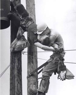 lowlightmonk:  saltrat88: totalharmonycycle:   sevenbones-blog: “The 1967 Pulitzer Prize award winning photo called ‘The Kiss of Life’ by Rocco Morobito. “This photo shows two power linemen, Randall Champion and J. D. Thompson, at the top of a
