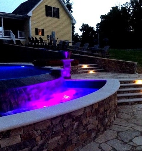 Contemporary PoolLarge Contemporary Infinity Hot Tub Design Idea With Backyard Stones.