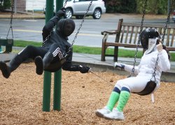 modernfencing: [ID: two fencers on swings,