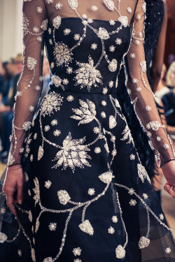 oscardelarenta:  Thousands of pearls are hand-embroidered on black tulle to create a breathtaking lotus motif. Photo by The Coveteur
