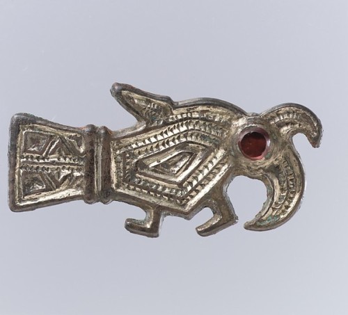 Frankish bird brooches, 6th centurySilver-gilt with garnets over patterned foilThe dress of Frankish