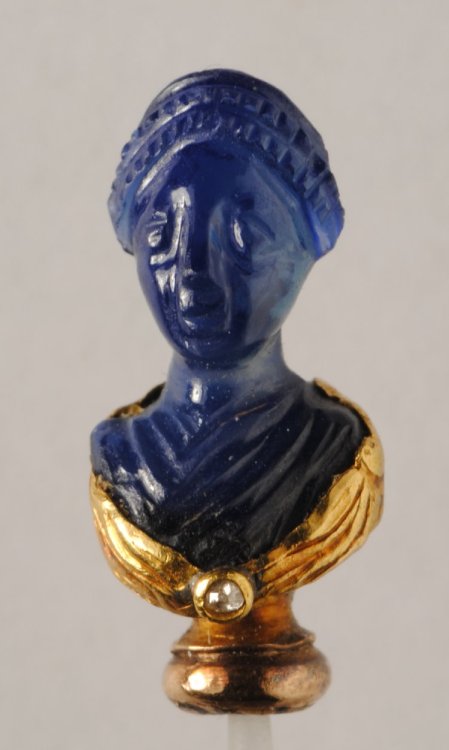 ancientpeoples: Dress-pin in the form of a carved sapphire and wrought gold bust representing a woma