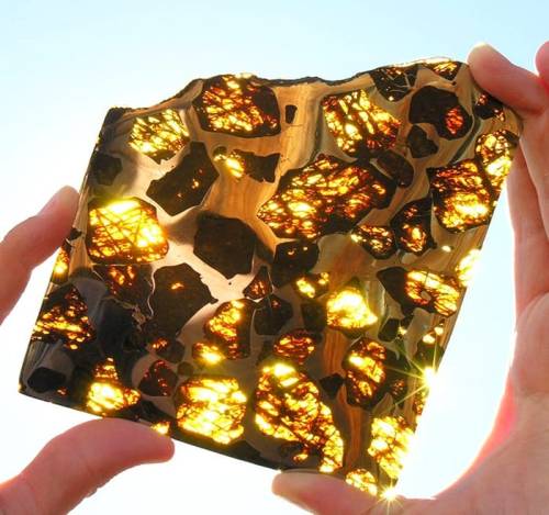 legendary-scholar:  Fukang Meteorite, this stunning piece of meteorite was found in the mountains near Fukang (hence the name), China back in 2000. The space rock is a pallasite - a type of stony-iron meteorite with olivine crystals. Fukang meteorite