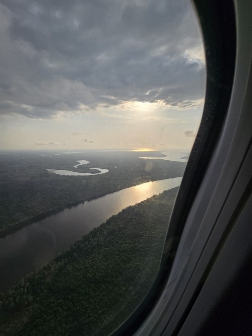 The Backwater Lagoons Of Cameroon, Africa, The Reflection Of The Sun And Hundreds Of Tin-roof Huts.