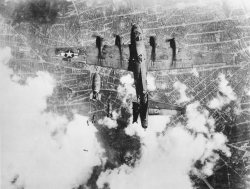 destroyed-and-abandoned:  Boeing B-17G “Miss Donna Mae II” drops out of formation after being struck by a bomb from the aircraft above it via reddit Read More  Oh wow, this is a really neat photo