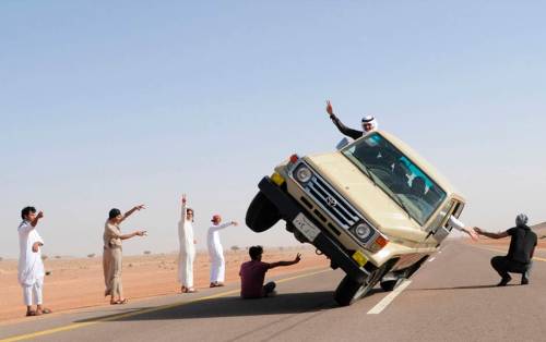 minusmanhattan:Saudi youths demonstrate a stunt known as “sidewall skiing” (driving on two wheels) i