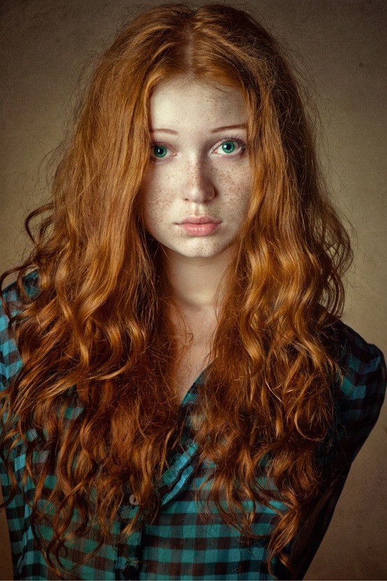 Girl with red hair freckles green eyes