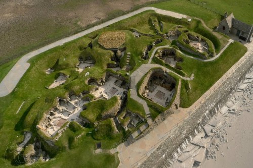 (via Skara Brae from above, a 5,000 year-old stone-built neolithic village on one of the Orkney Isla