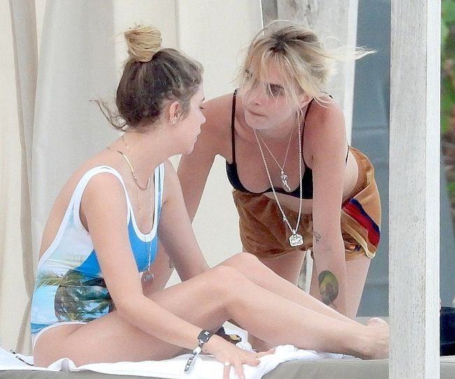 Ashley Benson &amp; Cara Delevingne Caught By Paparazzi Tanning In Bikini  (more…)View