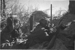 sovietpartisans:  Two Soviet soldiers watching the enemy from their snowy trench.