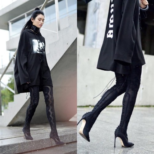 MING XI wearing FENTY PUMA BY RIHANNA hoodie and SERGIO ROSSI boots