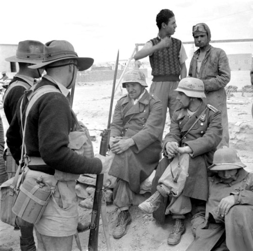 bag-of-dirt: Australian Army infantrymen of the 9th Division guard Italian soldiers, already ta