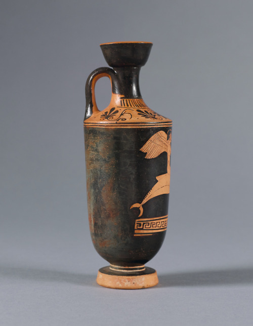 fishstickmonkey:Red-figure Lekythos: Eros Riding a Dolphin and Playing the Double Flutes (Auloi)attr