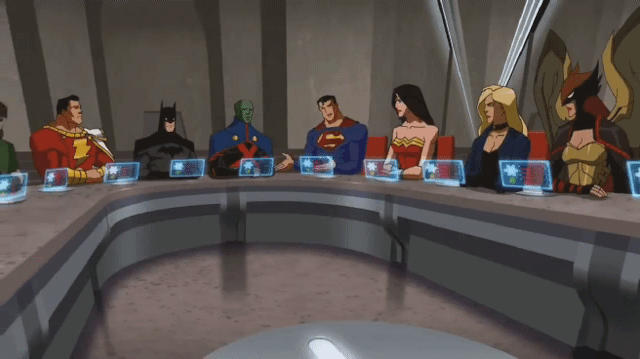 Members of the Justice League sit around a large table.