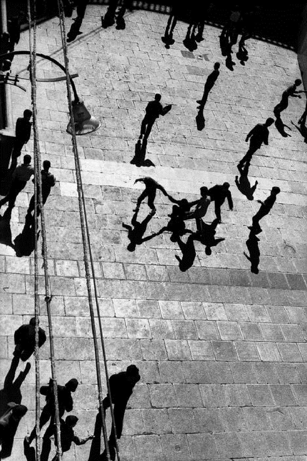 Sergio Larraín. Four men form a figure reminiscent of Matisse Dance, Algiers, 1959. Original story: Gerrilla War. From Magnum Photos