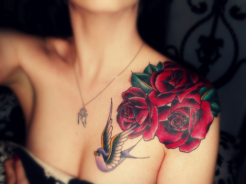 Upper arm rose tattoos for women