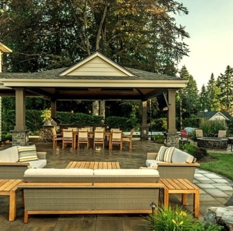 Seattle Fire PitAn Example Of A Large Traditional Backyard Stone Landscaping With A Fire Pit.