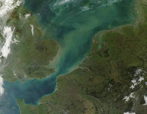 Swirling sedimentGreen and brown sediment swirls trough the North Sea on this true color image taken