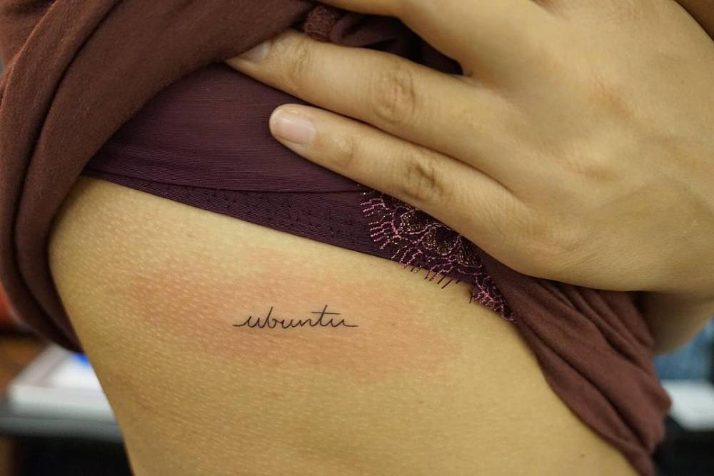 “Ubuntu” tattoo on Rachel Crow’s right side ribcage. Tattoo artist: Michelle Santana