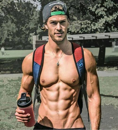 Holy sexy abs, Batman! What is it about backpack straps and shirtless men that is so appealing?! Don