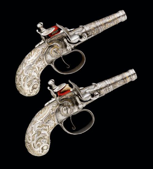 A pair of silver decorated flintlock pocket pistols from Liege, Belgium, circa 1740.