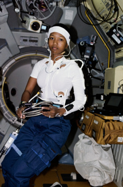 flavorcountry:Dr. Mae Jemison, MD, the first black woman in space and first actual astronaut to appear on a Star Trek show, one of the very few people on this planet of whom two pictures can be posted depicting them doing their job on a spaceship with