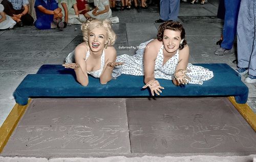 Marilyn Monroe and Jane Russell leave their handprints at Graumann’s Chinese Theatre in Hollyw