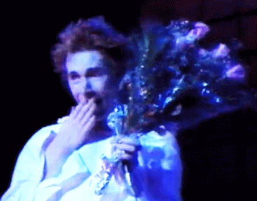 air-flows: Johnny Rotten receiving flowers as a pretty princess he is