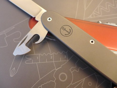 Titanium Pioneer with an engraved anchor (via ALM  Knives & Tools)