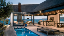 homestratosphere:  This seaside home has a gorgeous pool in the patio. This home has gorgeous seamless glass windows and doors that allow swimmers to take in the views. What do you think of this home’s pool?Designed by http://www.saota.com/