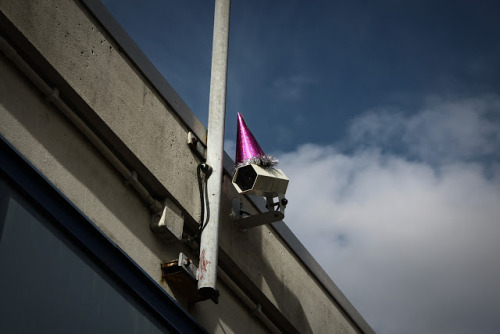 unicorn-meat-is-too-mainstream:  DECORATING SURVEILLANCE CAMERAS WITH PARTY HATS TO CELEBRATE GEORGE ORWELL’S BIRTHDAY