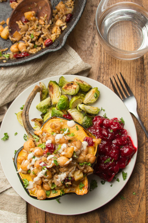 This stuffed acorn squash is as delicious as it is pretty! Filled with a whiskey-spiked mix of brown