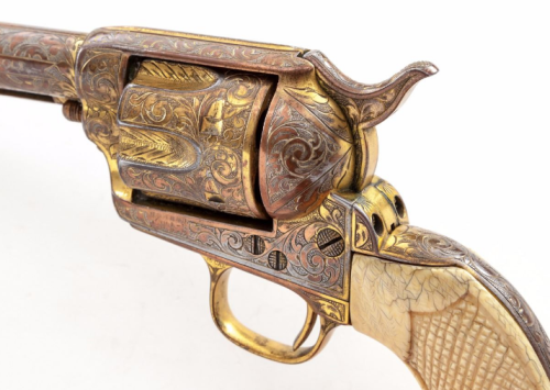 Engraved and gold washed Colt Model 1873 Single Action Army with carved Mexican Eagle ivory grips.fr