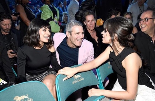 Camila Cabello chats with seat mates Mila Kunis and Andy Cohen during a commercial break at the 2018