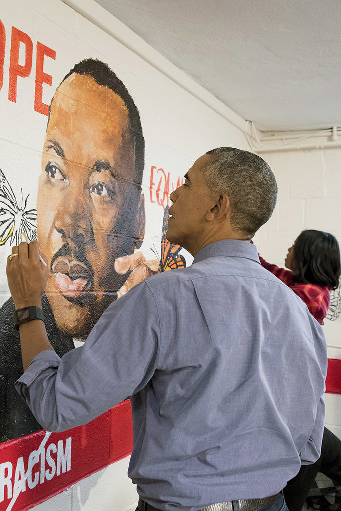 soph-okonedo:U.S. President Barack Obama and First Lady Michelle Obama help paint