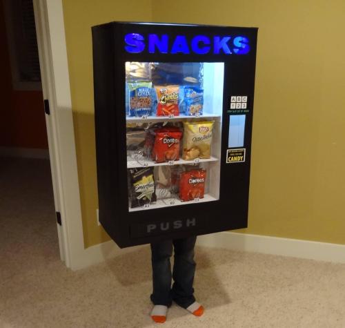 thedeskofdrychris:  queenwhiskey:  tayintheflesh:  pleatedjeans:  via  THE SNACK MACHINE!!!?!  A weapon to surpass metal gear  I could have sworn the UPS one was the costume until I looked down 