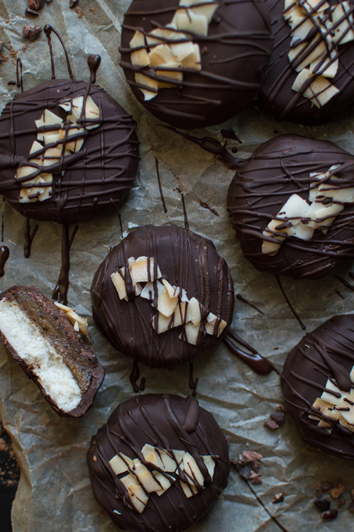 Raw chocolate covered coconut caramel patties. Fresh, creamy coconut, topped with a generous layer o