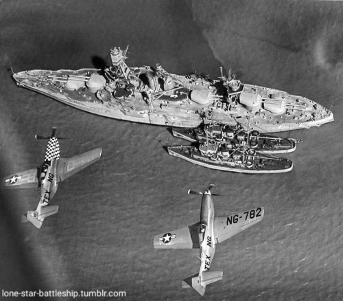 lone-star-battleship: USS Texas (BB-35) with two U.S. Navy Tugs in Galveston Bay, sometime between M