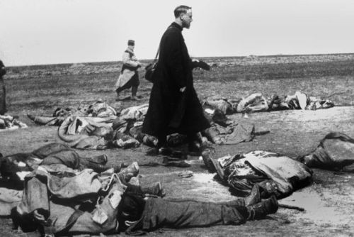 hinoenmayokai:  A French Priest walking among the dead in WWI